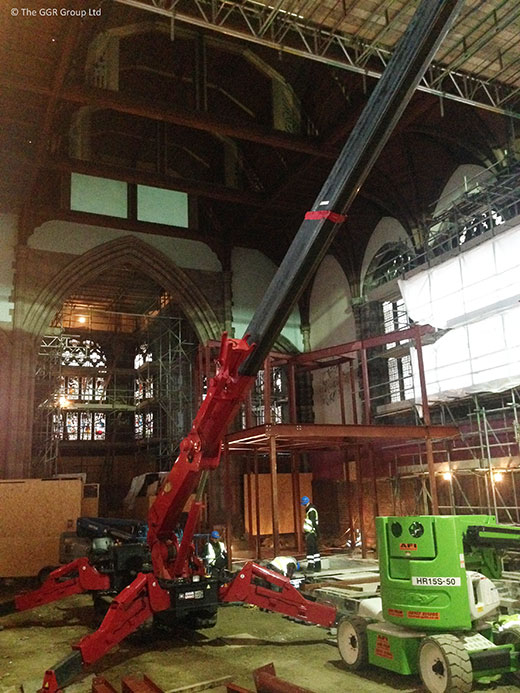 UNIC spider crane works inside church building