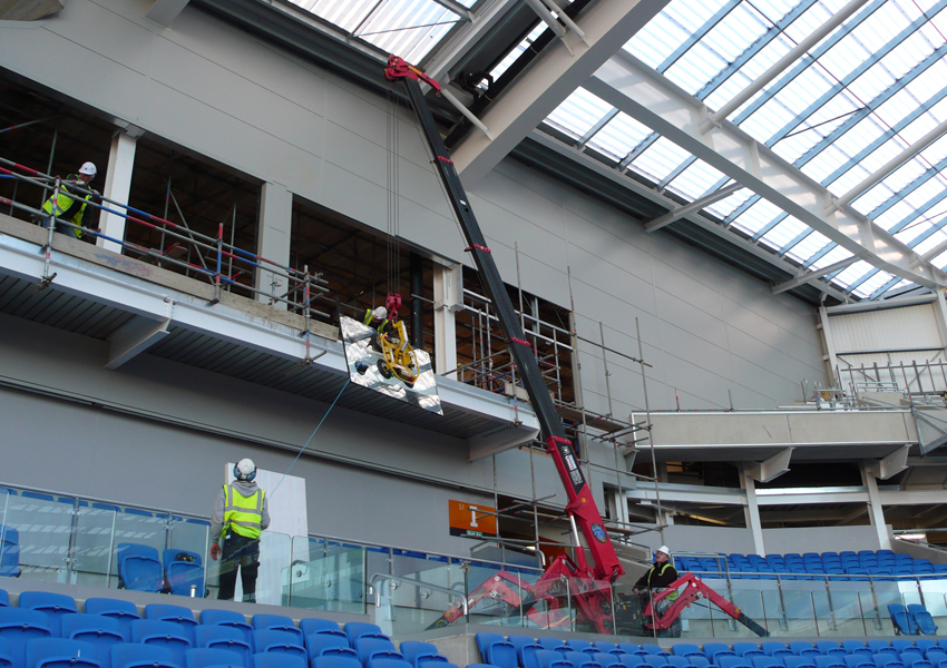 This URW-095 mini spider crane helped fit glass in some VIP viewing at Brighton's Falmer Stadium