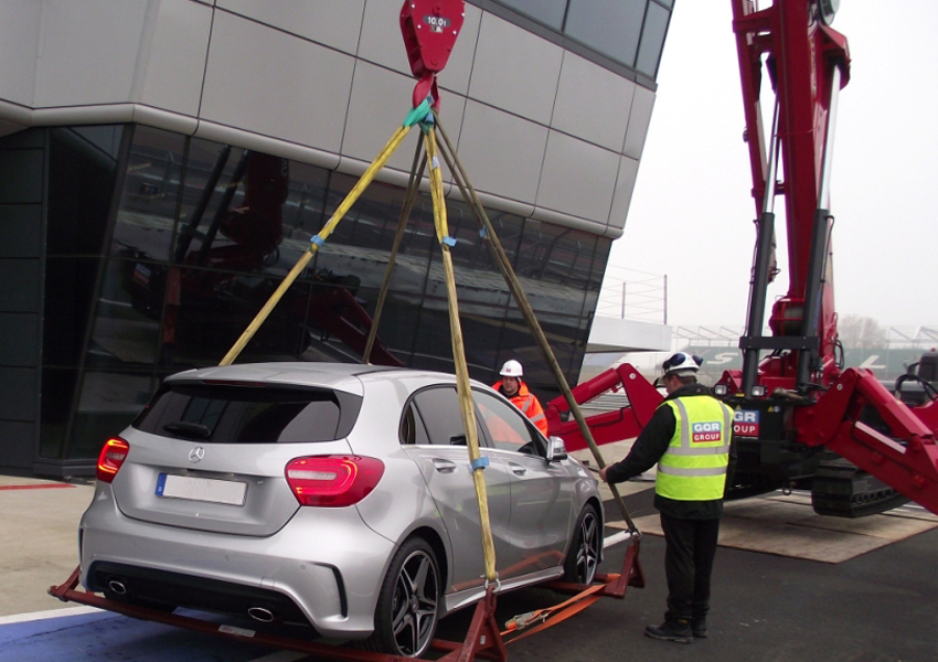 A 1006 mini crane helped lift this Mercedes Benz car onto the rooftop at Silverstone