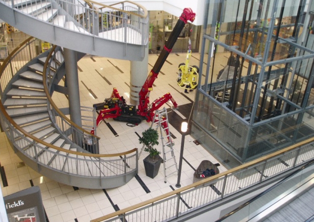 Working in Denmark this URW-095 mini spider crane and MRT4 vacuum lifter helped glaze a lift shaft