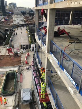 Lifting glass from a height with the UNIC URW-295 Mini Spider Crane.
