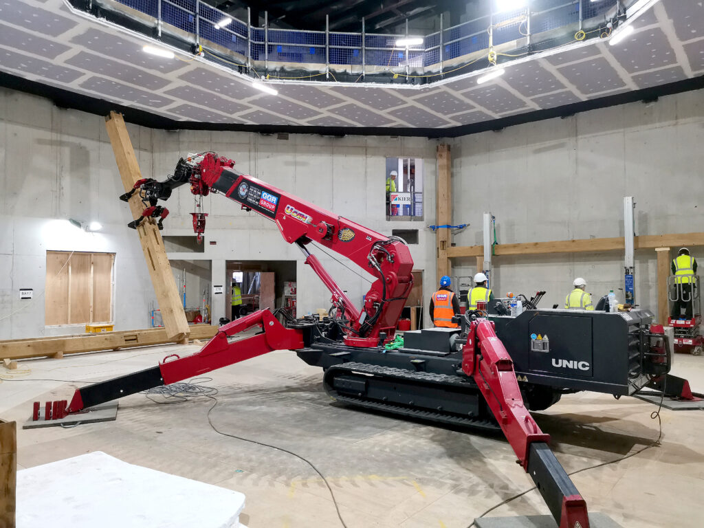 UNIC URW-706-2 Mini Spider Crane and Multigrab installing timber beams for Shakespeare North Playhouse.