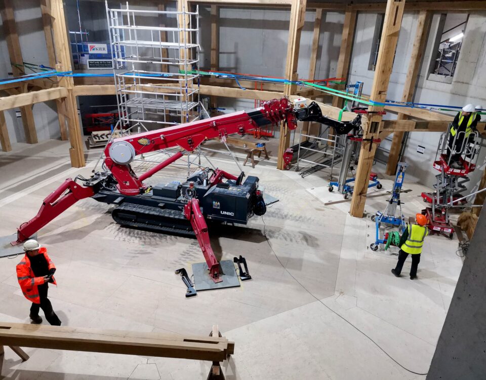 UNIC URW-706-2 Mini Spider Crane and Multigrab installing timber beams for Shakespeare North Playhouse.